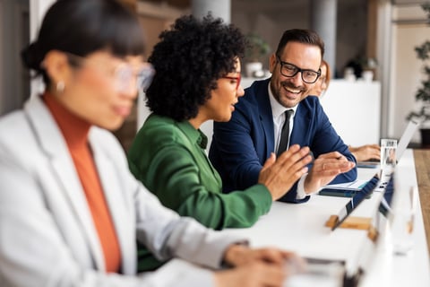 Diverse group of business professionals collaborating and sharing ideas
